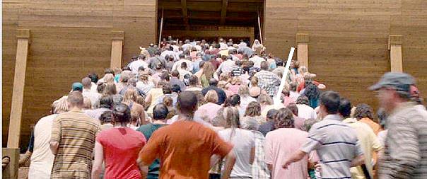 This was the most fun scene in the movie to film. With 350 other extras, I (white arrow) stampeded up the ramp to take refuge inside the immense ark as Steve Carrell in white beard and robe stood at the top right to encourage us onward. The ground had been soaked with simulated rain so all 350 of us slipped and slogged as fast as we could through the boggy ground and up the ramp. One of the coolest things was that we were directed in this scene by second unit director Mickey Gilbert who was a stuntman in Ben Hur and The Wild Bunch.